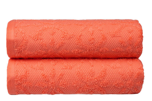 istock multicolored terry towels, rolled up and stacked on the table 1555783953