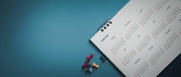 istock Embroidered red pins on a calendar event Planner calendar,clock to set timetable organize schedule,planning for business meeting or travel planning concept. 1555794508