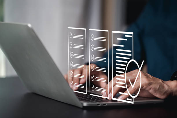istock Performance checklist, businessman using checklist survey, filling out digital form checklist, take an assessment, questionnaire, evaluation, online survey, online exam. 1555794976
