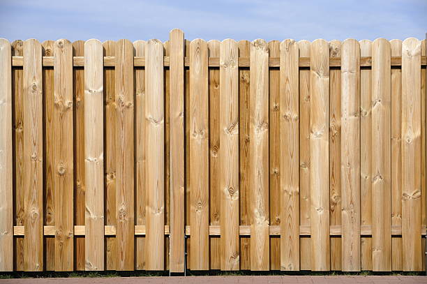 istock A wood fence that divides properties 155579561