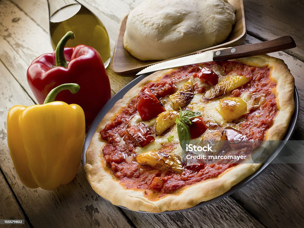 pizza with pepper pizza with pepper - Photographed with Mamiya 645DF 33 MPx Digital Back Leaf Aptus II and Schneider Kreuznach lens Baked Stock Photo