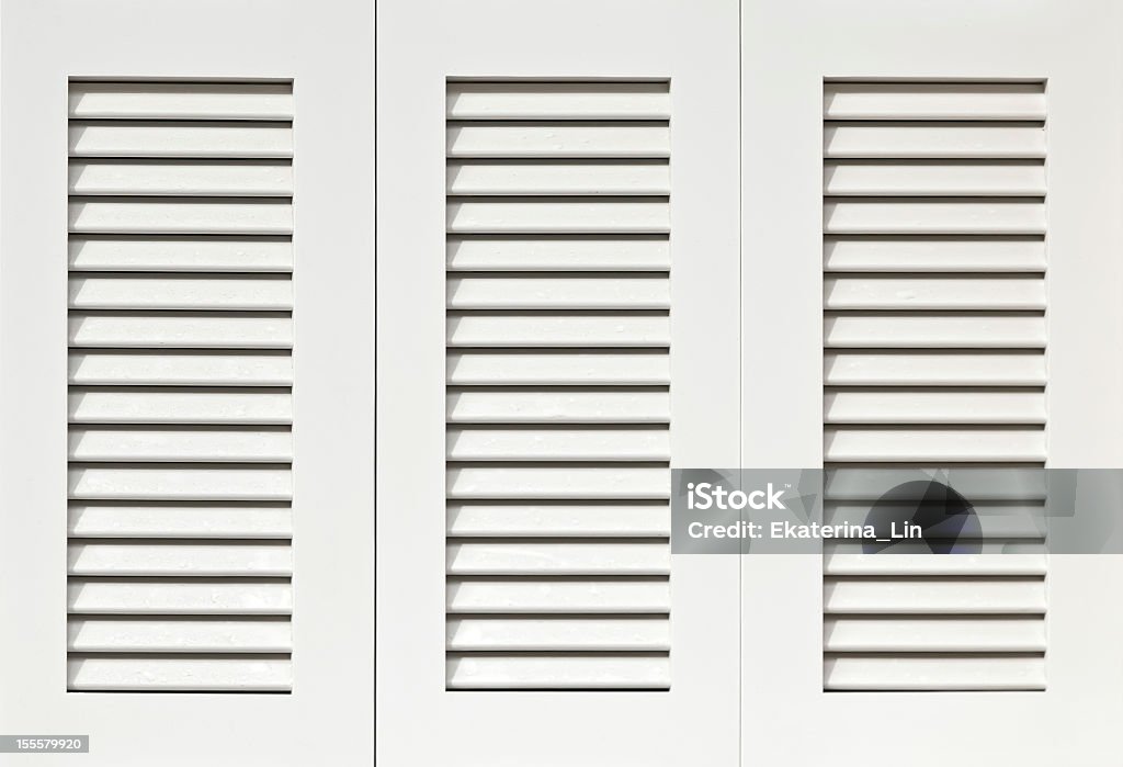 Clean white shutters ready for installation Window with white shutters Shutter Stock Photo