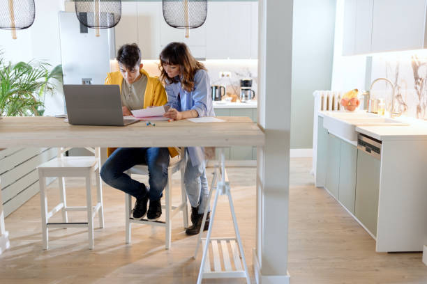 istock Mother and son studying together 1555804010