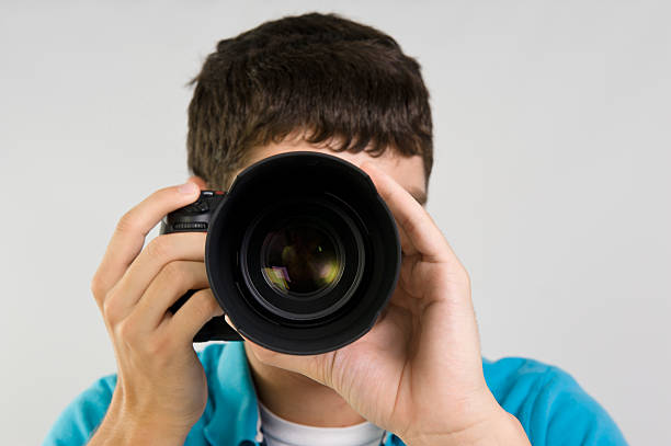istock Male taking a picture with his digital camera 155580550