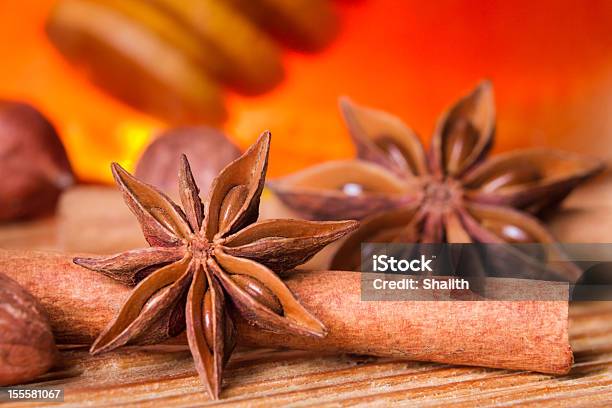 Honey Jar Star Anise And Cinnamon Bark Stock Photo - Download Image Now - Cinnamon, Honey, Star Anise