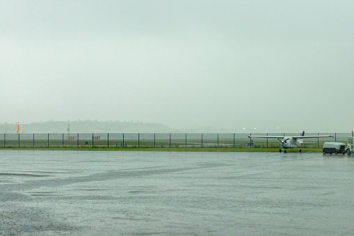 An airport being swamped by bad weather, with heavy rainfall during a storm.