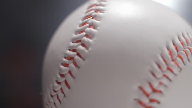 Baseball ball in studio close-up, macro, with smoke 4K, slow-motion