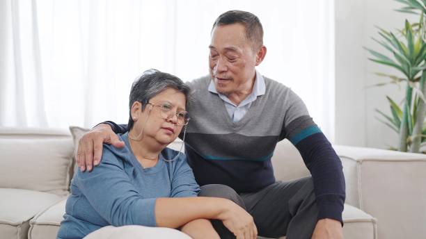 istock Asian elderly man caring wife embracing bonding comforting and express empathy, supporting giving loving. Couple retirement lifestyle 1555815316