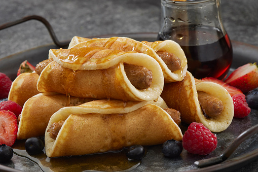 Breakfast Pancake Pigs in a Blanket with Sausage, Fruit and Maple Syrup
