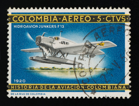 Colombian postage stamp on black background. Studio Shot. 