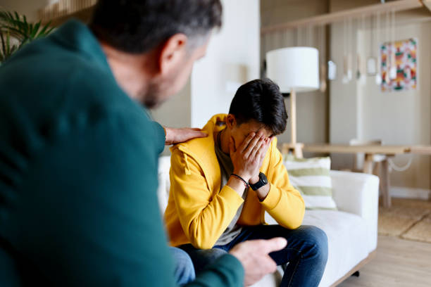istock Worried son taking advice from his father 1555853654