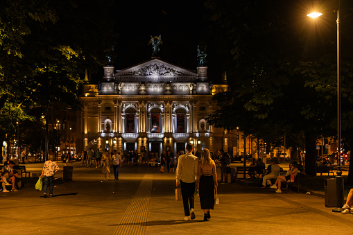 Lviv, Ukraine - July 12, 2023: Young couple near Lviv National Opera