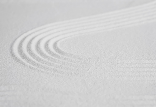 Zen garden with line pattern on white sand in Japanese style, Sand texture surface with wave parallel lines,Background banner for Meditation,Zen like concept,Simplicity Day