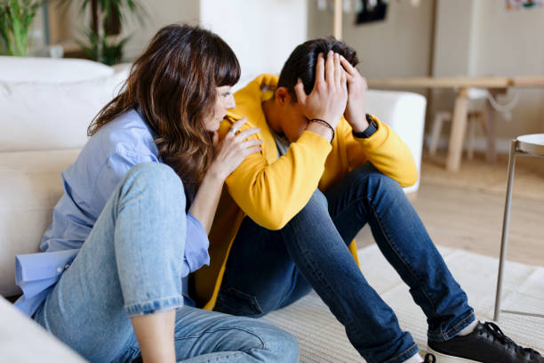 istock Worried son talking with his loving mother 1555875105