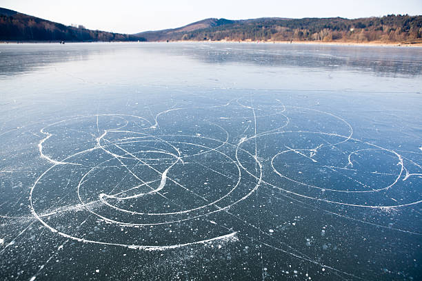Ice skates trails on frozen lake, Brno dam stock photo