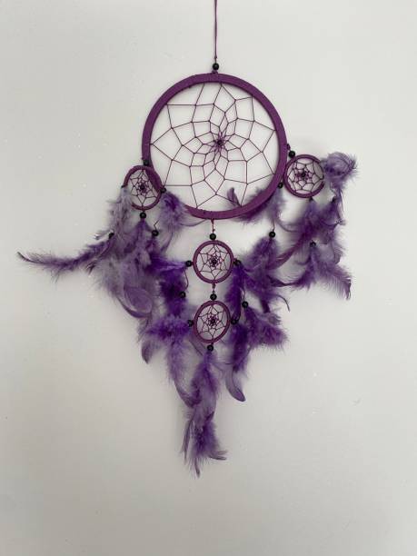 istock A purple dreamcatcher in a white wall.. 1555890227