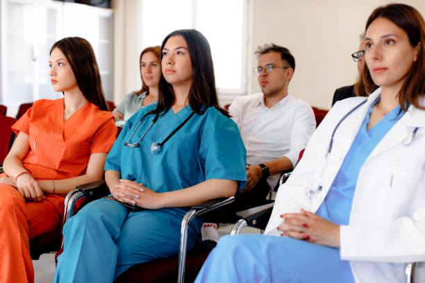 istock Focused Minds: Serious Audience at Business Seminar 1555891820