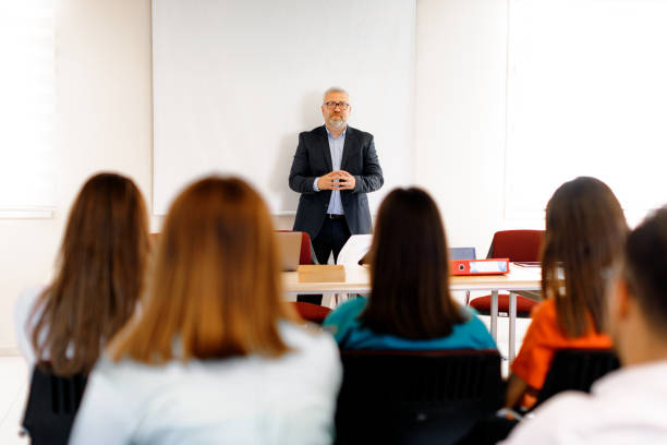 istock Knowledge Exchange: Diverse Audience Engaged at Business Conference 1555899097
