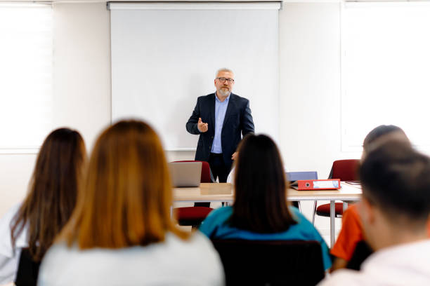 istock Knowledge Exchange: Diverse Audience Engaged at Business Conference 1555899098