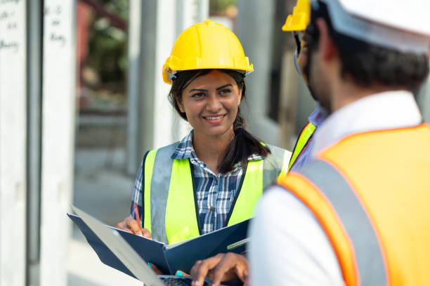 istock Professional Mechanical Engineer team Working on Personal laptop computer at Prefabricated concrete factory Heavy industrial. Product quality Inspection. Unity and teamwork concept 1555916249
