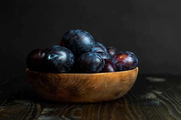 istock Ripe plums on the table in the kitchen 1555918006