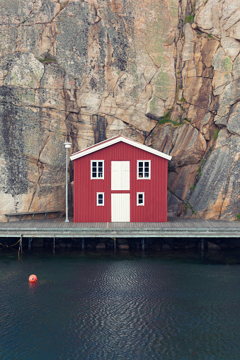 A red boathouse by the rock in the coastal town of Smögen, Bohuslän.