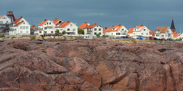 Rocky coastline with houses on top of the cliff in Smögen, Bohuslän, Sweden.