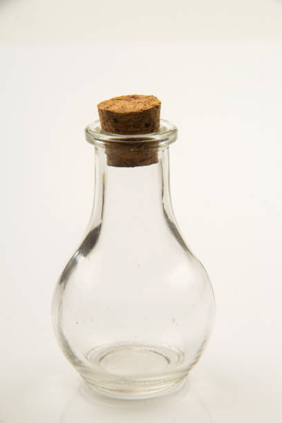 istock Small empty transparent glass vial on white background 1555941688