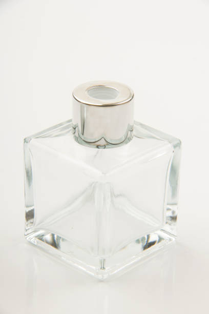 istock Small empty transparent glass vial on white background 1555941691