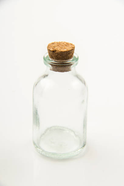 istock Small empty transparent glass vial on white background 1555947350