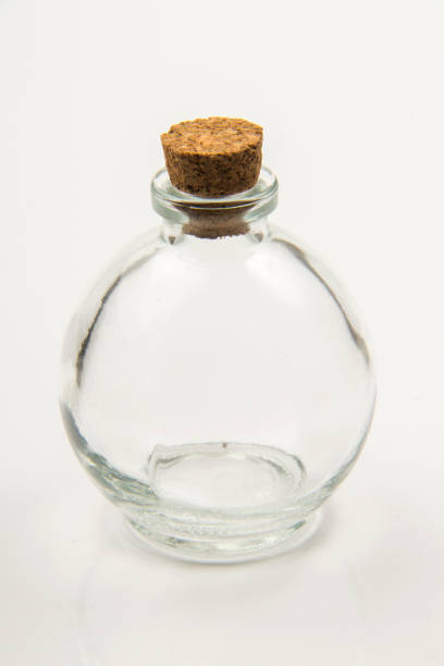 istock Small empty transparent glass vial on white background 1555947669