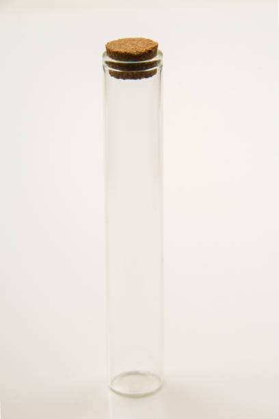 istock Small empty transparent glass vial on white background 1555948027