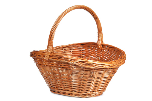 Brown wicker basket isolated on white.