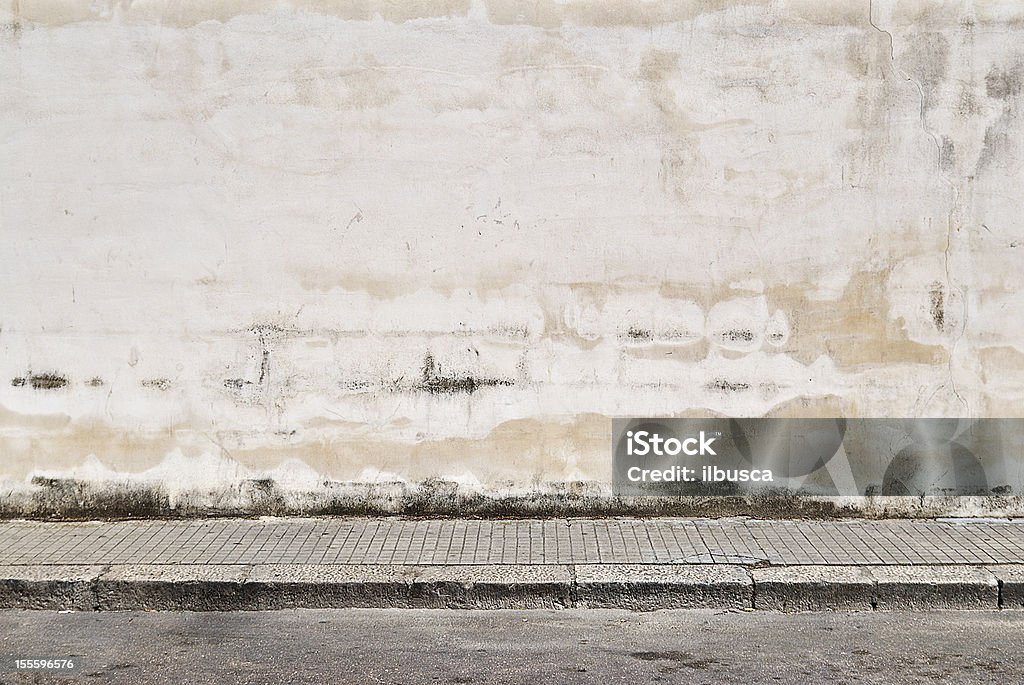 Old concrete grunge wall with sidewalk Wall - Building Feature Stock Photo