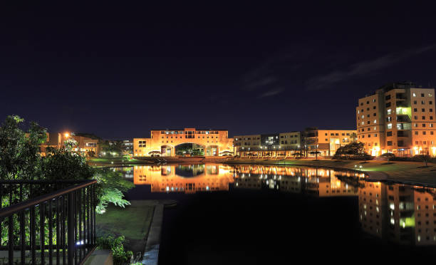 istock Central courtyard through arch and over lake at night 155596663