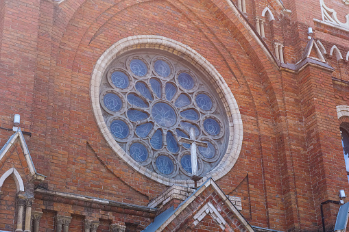 A close-up shot of a stained glass window of a catholic church.