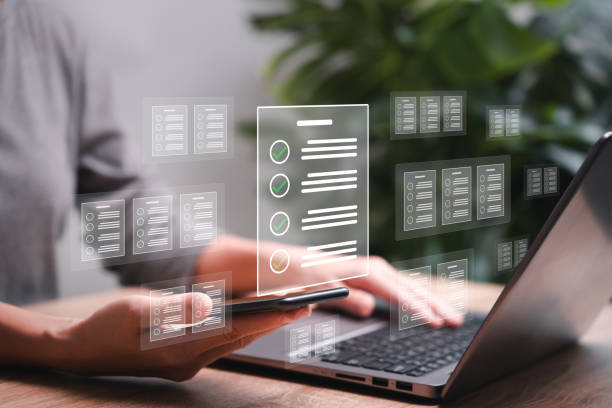istock Document management and smart  checklist concept, Businesswomen show e-document on smartphone online management on virtual screen automation to efficiently document paperless operation technology 1555970319