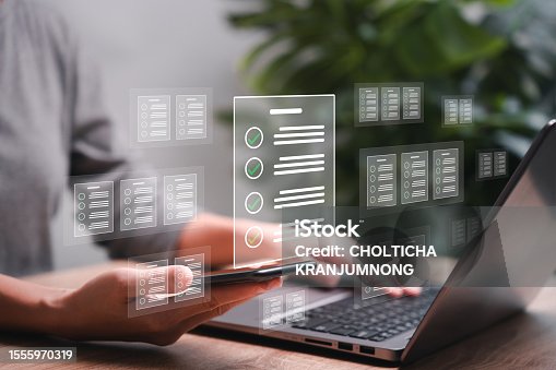 istock Document management and smart  checklist concept, Businesswomen show e-document on smartphone online management on virtual screen automation to efficiently document paperless operation technology 1555970319