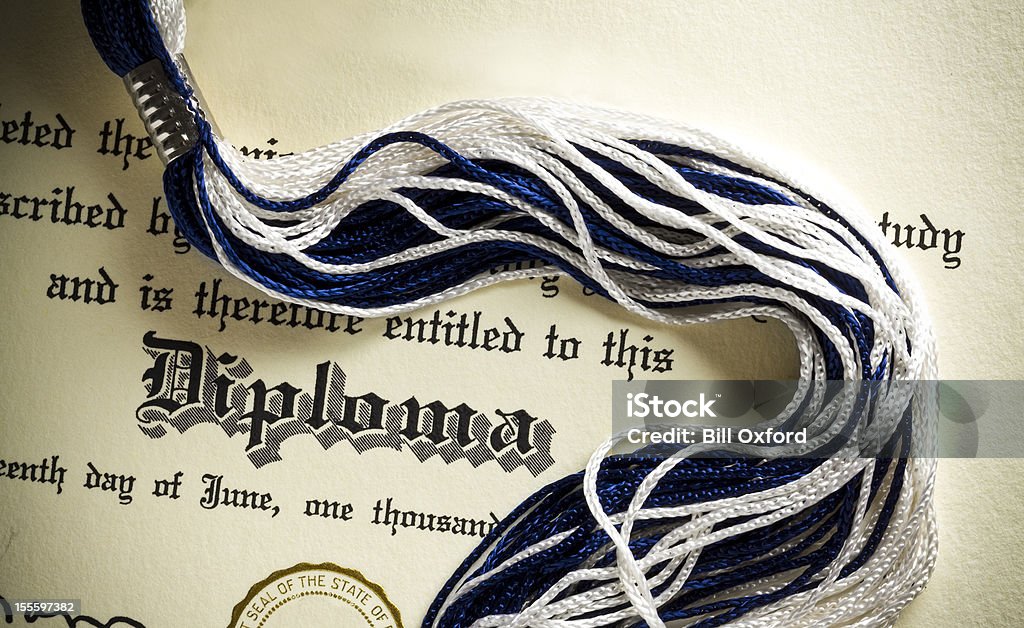 High School Diploma Diploma and tassel shot from above.  Concept for graduation. Diploma Stock Photo