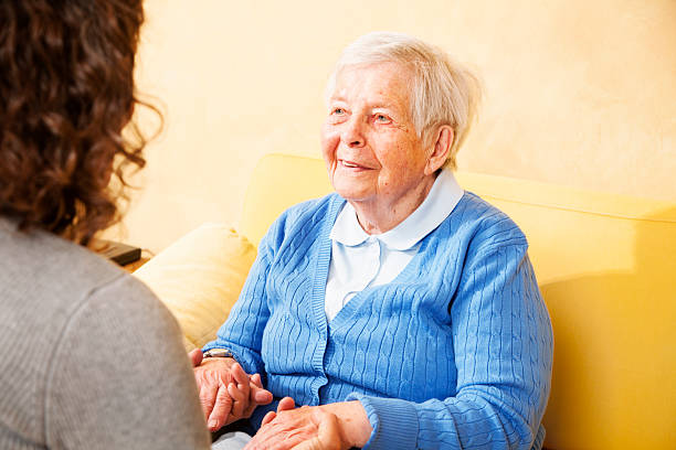istock senior woman happiness holding hands 155597511