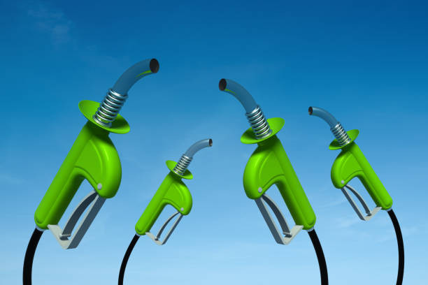 istock Gas Pump Nozzles and Sky 155597728