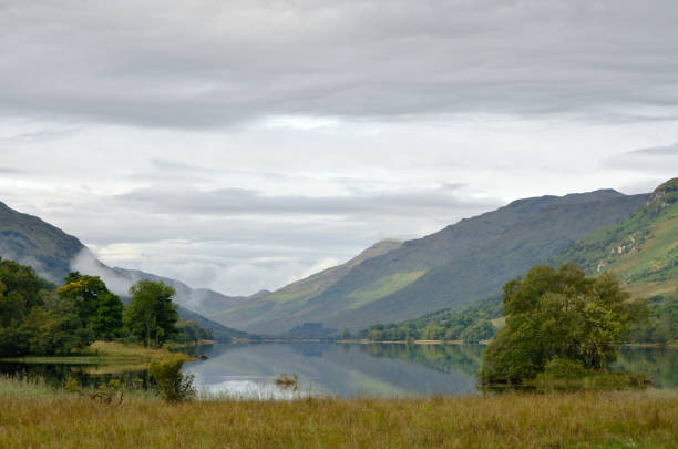 Loch Voil in Scotland Photograph taken at 09:24am at an altitude of one hundred and thirty four metres on Thursday 12th September 2013 on the shoreline of Loch Voil, at Balquhidder, Scotland. loch voil stock pictures, royalty-free photos & images