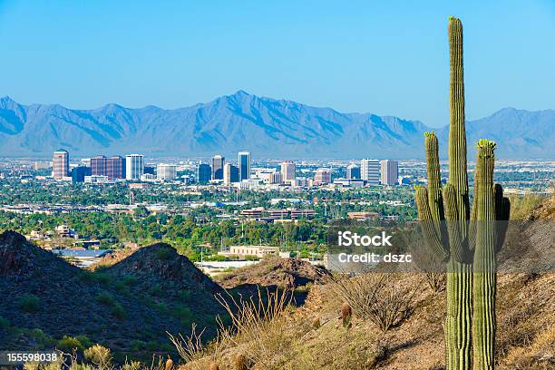 Phoenix Skyline Framed By Saguaro Cactus And Mountainous Desert Stock Photo - Download Image Now