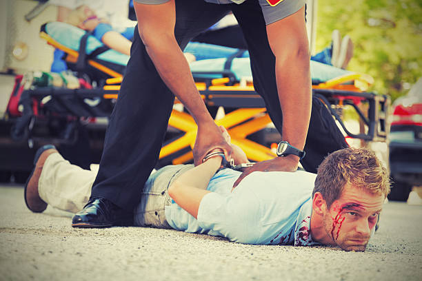 istock Man on the ground being arrested at crime scene 155598204