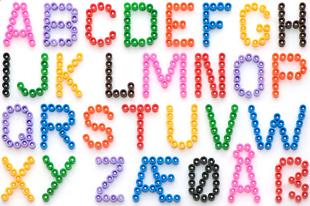 Alfabeto colorato perline in tedesco - foto stock