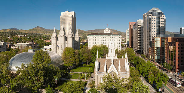 Salt Lake City Mormon Tabernacle Temple Square Utah High angle vista over the iconic landmarks of downtown Salt Lake City, the Mormon Tabernacle, Salt Lake Temple, Temple Square, church office buildings and the high rises of downtown under clear blue panoramic skies, Utah, USA. ProPhoto RGB profile for maximum color fidelity and gamut. salt lake city mormon temple utah photos stock pictures, royalty-free photos & images