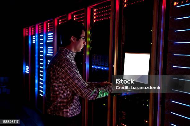 It Engineer In Action Configuring Servers Stock Photo - Download Image Now - Network Server, Rack, Adult