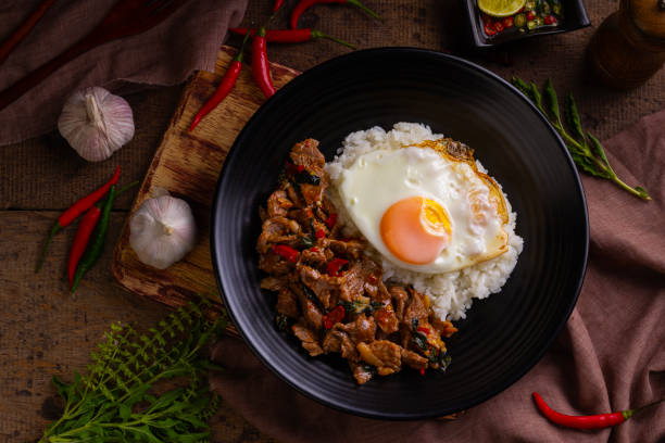 istock Stir fried sliced Beef with Holy Basil and Cooked Rice 1555989451