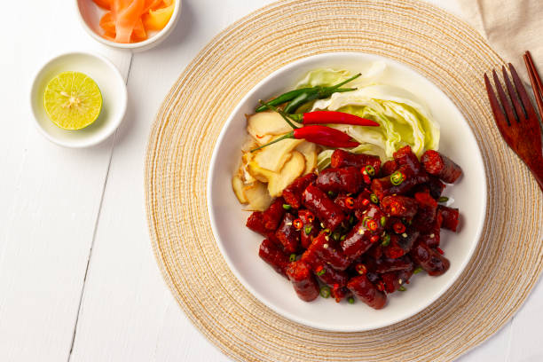 istock Thai Red Sausage Feast,fermented pork and rice sausage (Sai Krok Isan) 1555989980