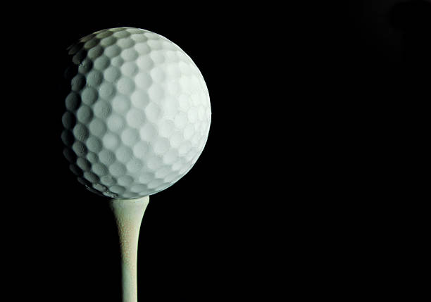 istock Golf Ball Off Center on Black 155599231